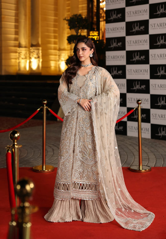 Woman in an elegant dress on a red carpet with Elaf Stardom Handwork.