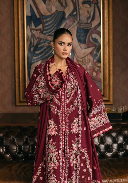 Woman wearing a burgundy embroidered traditional outfit in an ornate room from elaf LUXURY WINTER '25
